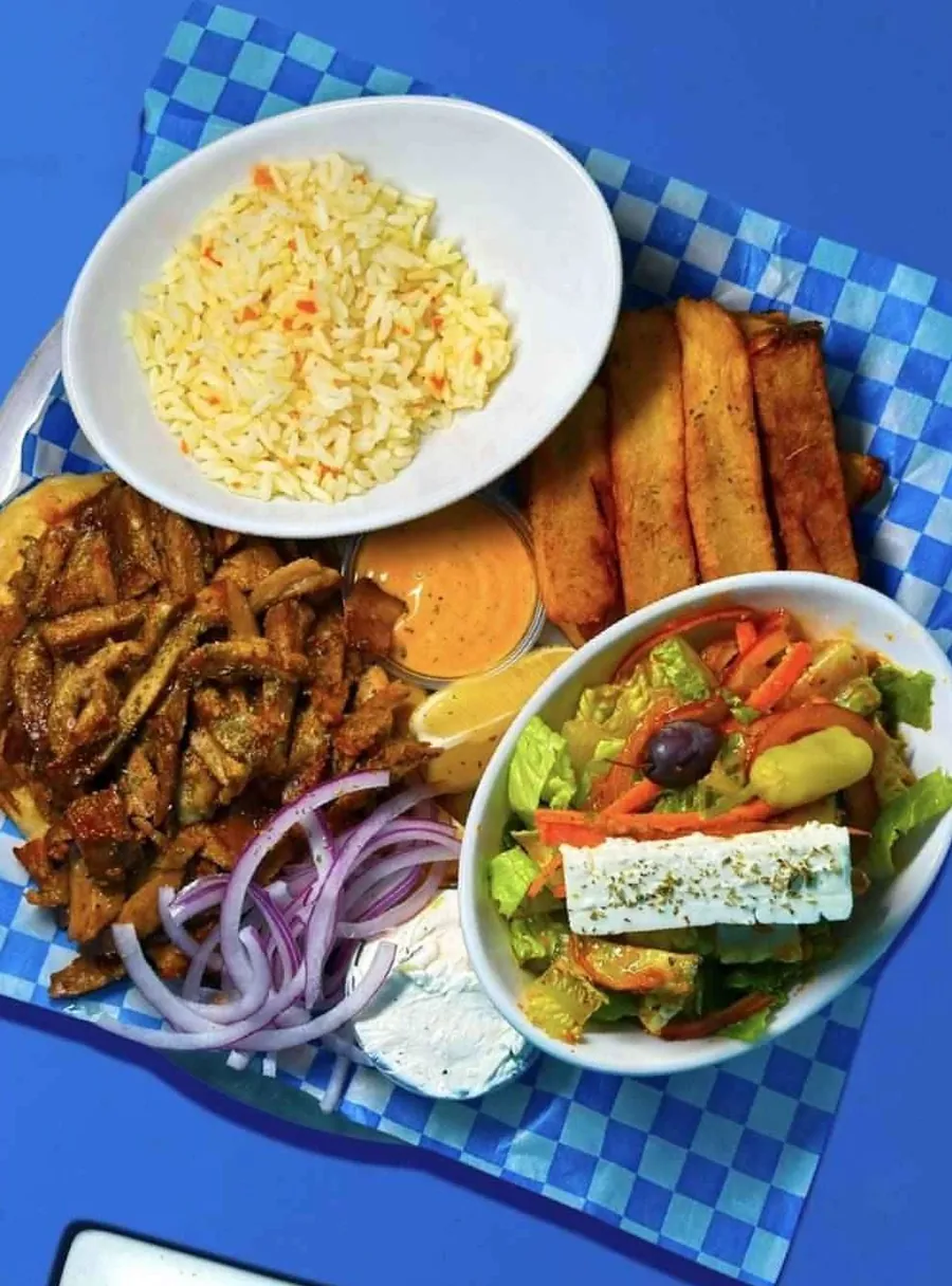 Gyro plate with rice, lemon potatoes, Greek salad and tzatziki